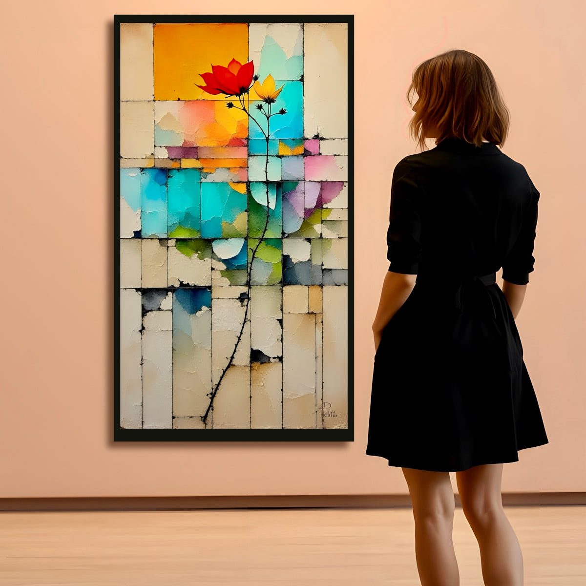 Woman in a black dress standing in front of a colorful abstract flower painting on a beige wall.